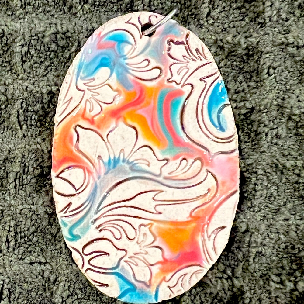 Clay pendant with colored waves